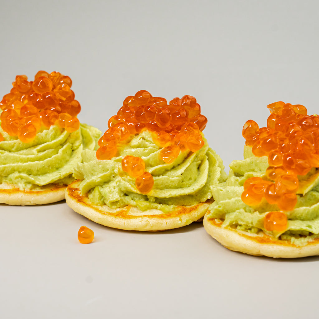 Salmon or Trout Caviar on Mini Pancakes with Avocado Mousse